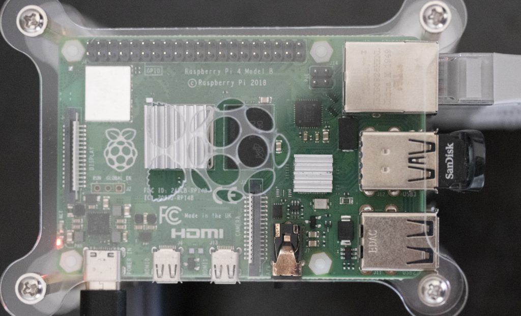 A top down photo of a Raspberry Pi 4 in a stackable Pi case.